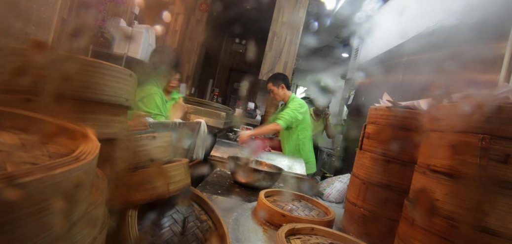 A chef prepares a rice pastry roll at th